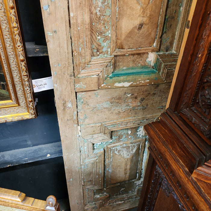 PAIR OF DISTRESSED GREEN PRIMITIVE EGYPTIAN PANELED DOORS WITH CENTER ROUNDS