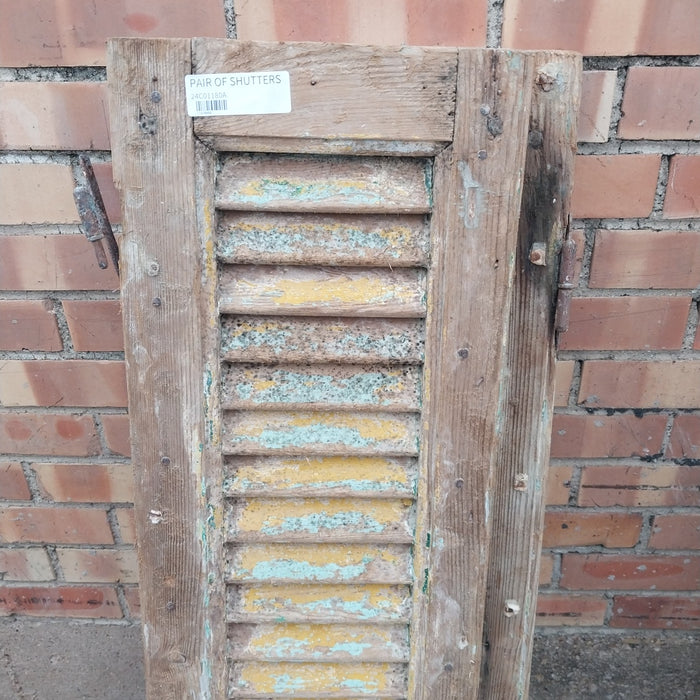 PAIR OF SHABBY GREEN AND YELLOW SHUTTERS