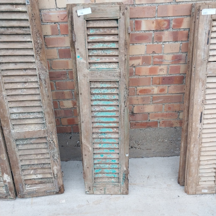 PAIR OF DISTRESSED SHUTTERS WITH GREEN PAINT