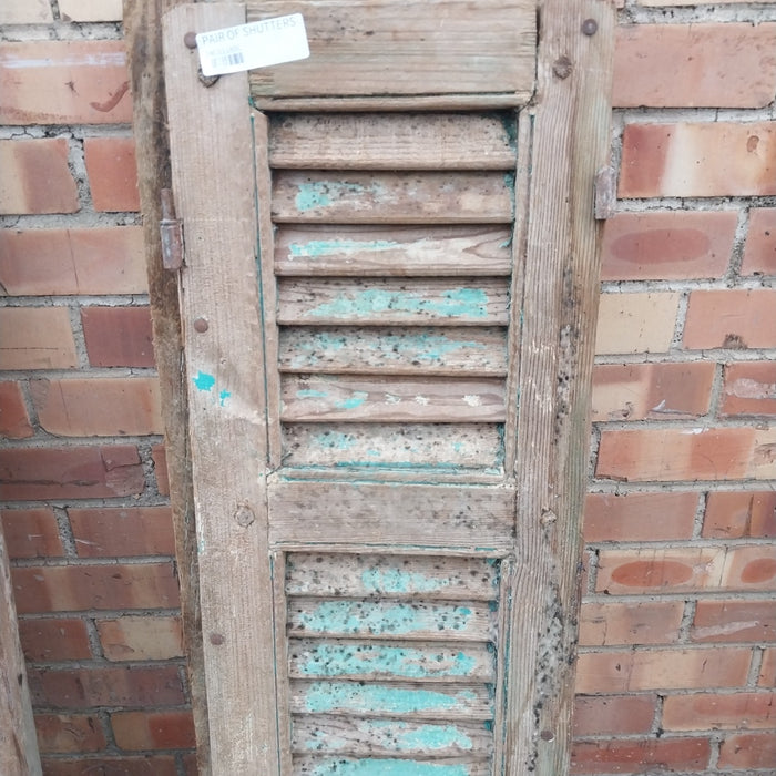 PAIR OF DISTRESSED SHUTTERS WITH GREEN PAINT