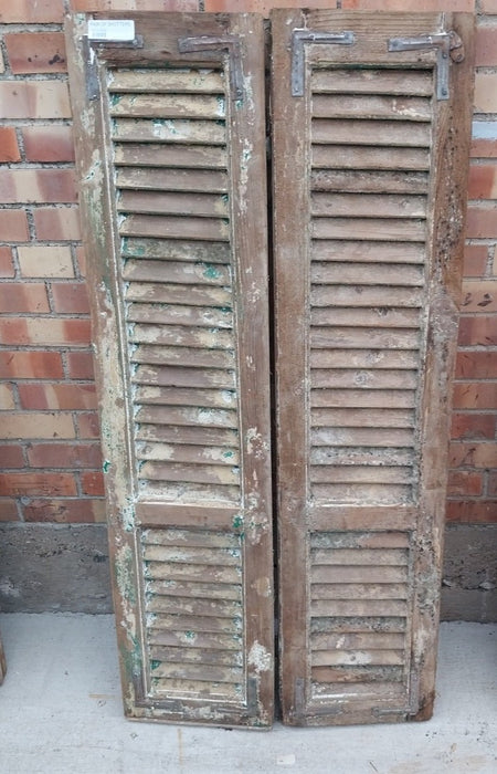 PAIR OF DISTRESSED SHUTTERS WITH GREEN AND YELLOW PAINT