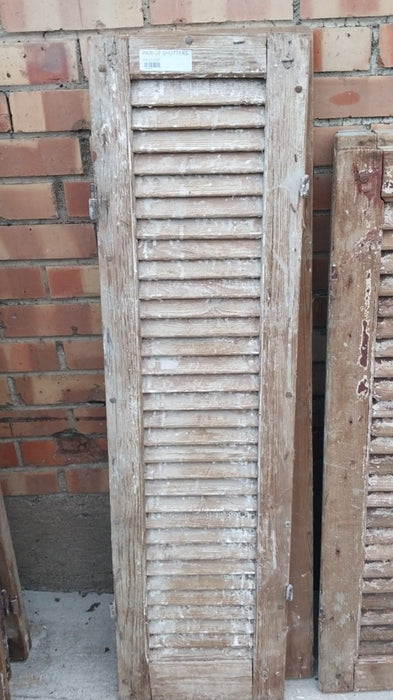 PAIR OF DISTRESSED SHUTTERS WITH BROWN PAINT