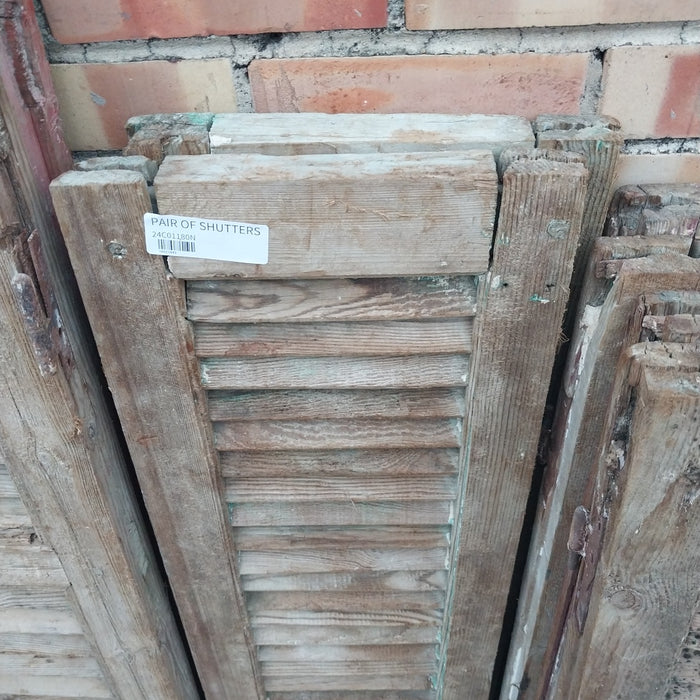 PAIR OF DISTRESSED SHUTTERS WITH GREEN PAINT