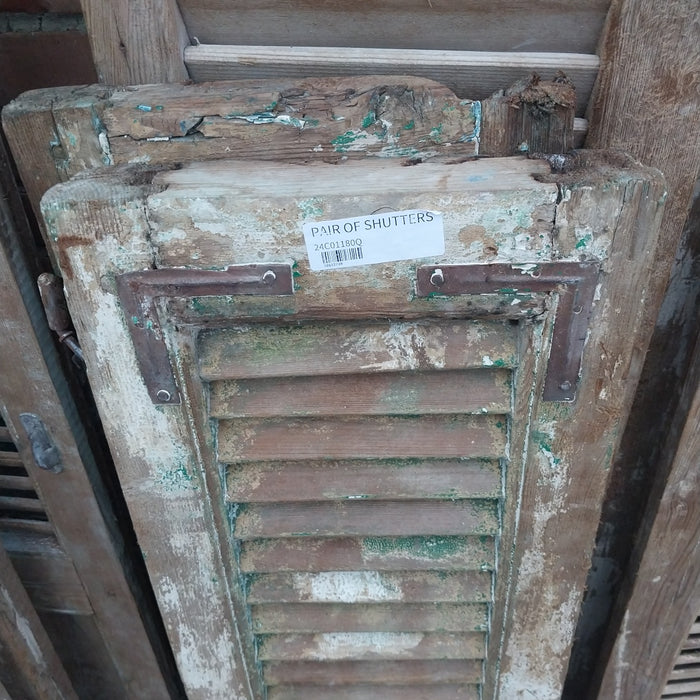 PAIR OF DISTRESSED SHUTTERS WITH GREEN PAINT