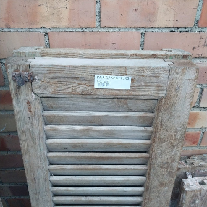 PAIR OF DISTRESSED SHUTTERS WITH GREEN PAINT