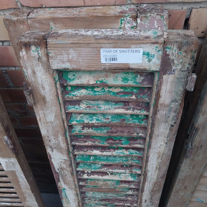 PAIR OF DISTRESSED SHUTTERS WITH GREEN PAINT