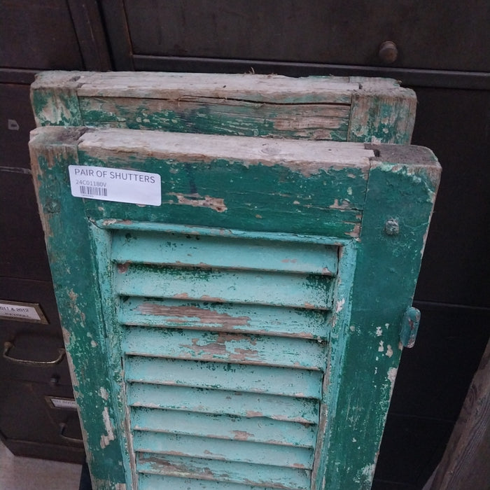 PAIR OF DISTRESSED SHUTTERS WITH GREEN PAINT