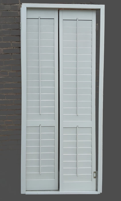 PAIR OF INTERIOR SHUTTERS IN FRAME