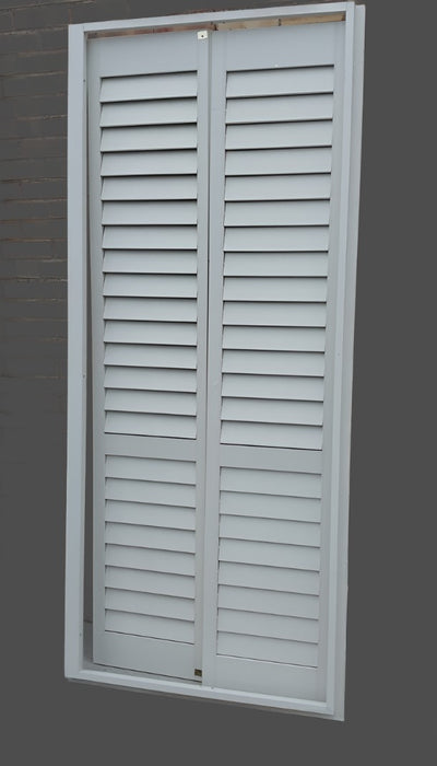 PAIR OF INTERIOR SHUTTERS IN FRAME
