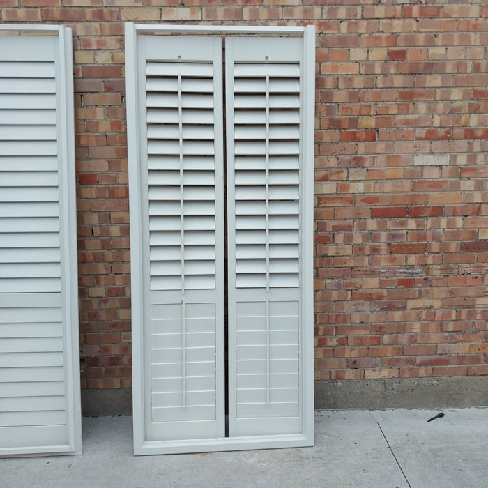 PAIR OF INTERIOR SHUTTERS IN FRAME