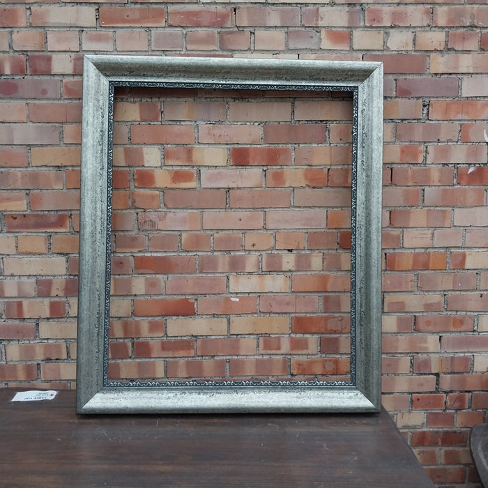 SILVER GILT AND BLACK FRAME