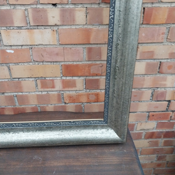 SILVER GILT AND BLACK FRAME
