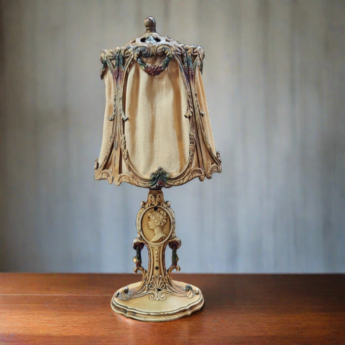 SMALL IRON TABLE LAMP WITH LADY MEDALLION AND SHADE