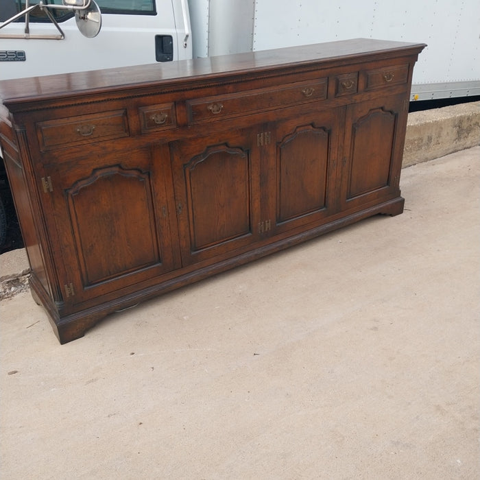 LARGE DARK OAK SIDEBOARD WITH ARCHED DOORS AND H HINGES