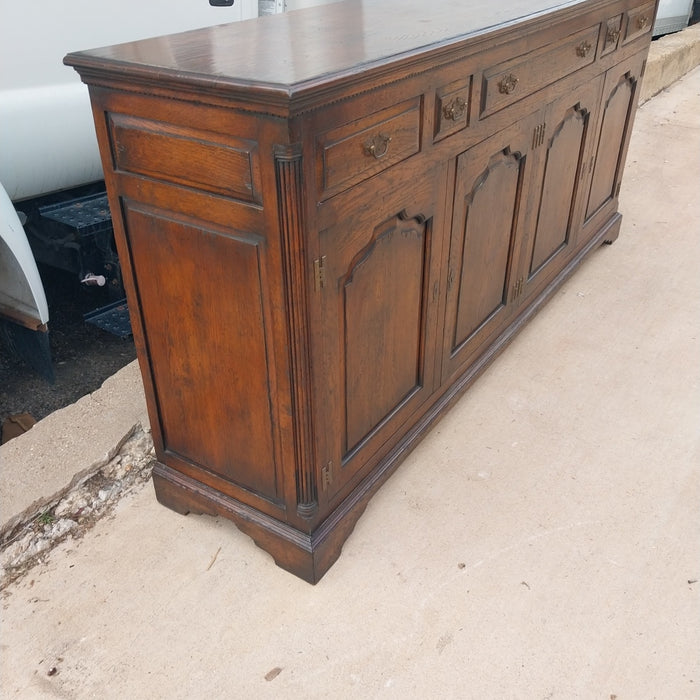 LARGE DARK OAK SIDEBOARD WITH ARCHED DOORS AND H HINGES