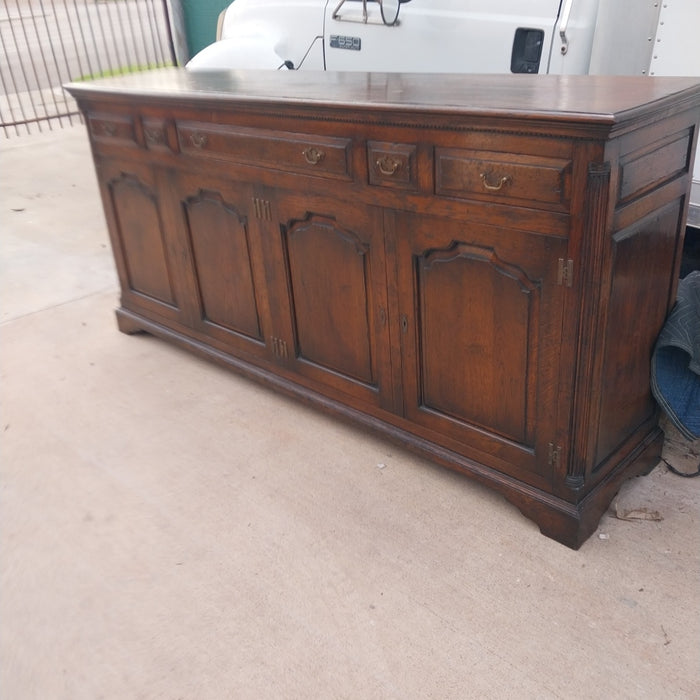 LARGE DARK OAK SIDEBOARD WITH ARCHED DOORS AND H HINGES