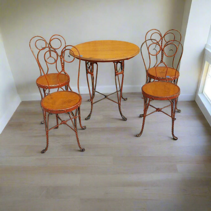 ANTIQUE IRON AND WOOD PARLOR TABLE WITH 4 CHAIRS