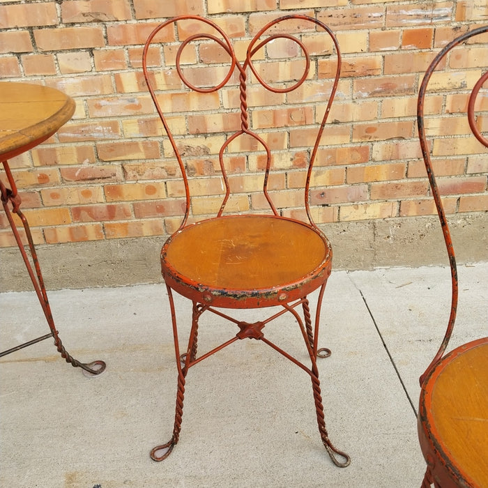 ANTIQUE IRON AND WOOD PARLOR TABLE WITH 4 CHAIRS