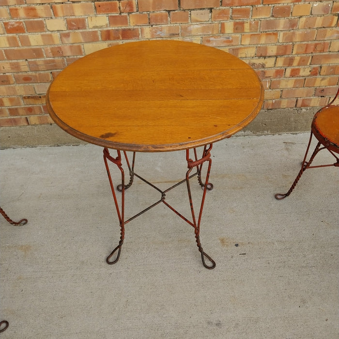 ANTIQUE IRON AND WOOD PARLOR TABLE WITH 4 CHAIRS