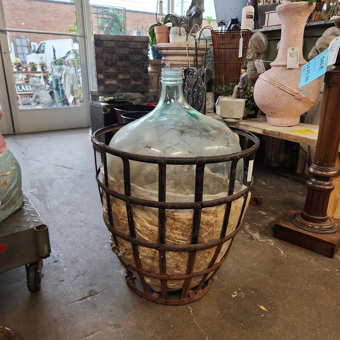 LARGE WINE BOTTLE IN BASKET