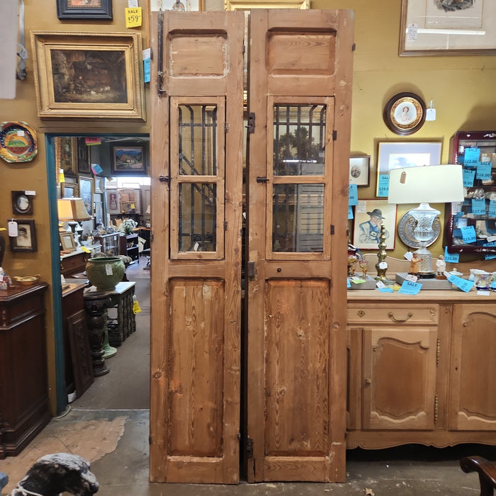 PAIR OF TALL PRIMITIVE EGYPTIAN DOORS WITH IRON INSETS AND GEOMETRIC DESIGN