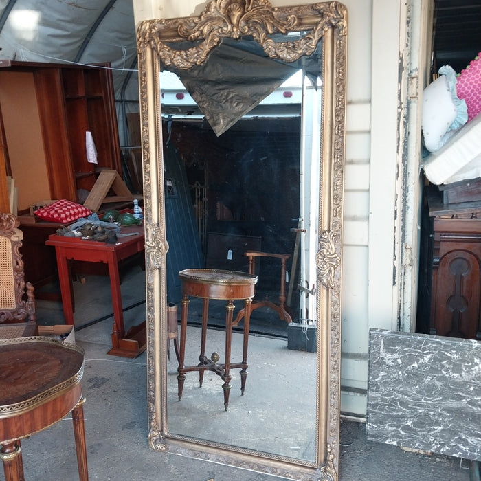 SHELL AND SWAG CROWNED GILT FRAMED BEVELED MIRROR