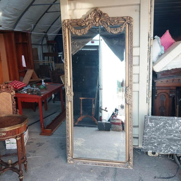 SHELL AND SWAG CROWNED GILT FRAMED BEVELED MIRROR