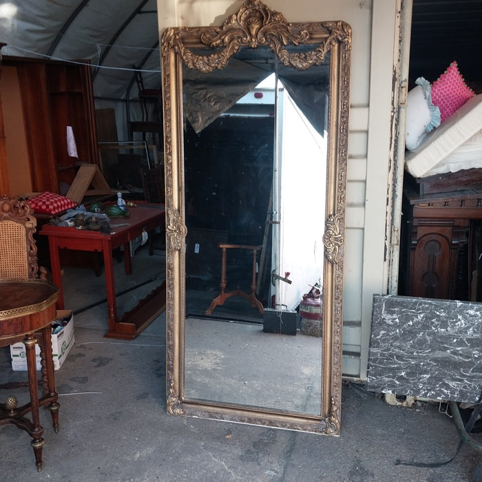 SHELL AND SWAG CROWNED GILT FRAMED BEVELED MIRROR