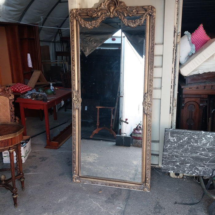 SHELL AND SWAG CROWNED GILT FRAMED BEVELED MIRROR