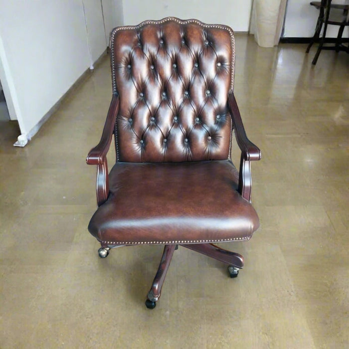 BROWN TUFTED LEATHER ROLLING ARM CHAIR