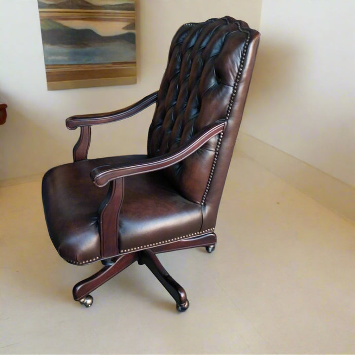 BROWN TUFTED LEATHER ROLLING ARM CHAIR