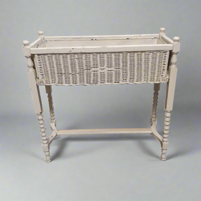WHITE WICKER PLANTER ON LEGS