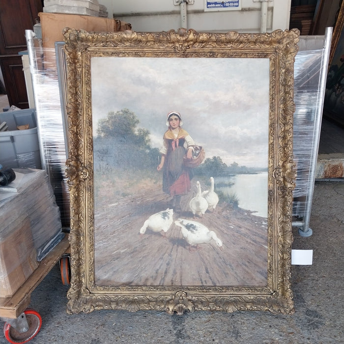 FRAMED ANTIQUE OIL PAINTING OF A GIRL WALKING WITH GEESE