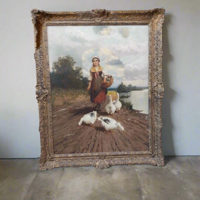 FRAMED ANTIQUE OIL PAINTING OF A GIRL WALKING WITH GEESE