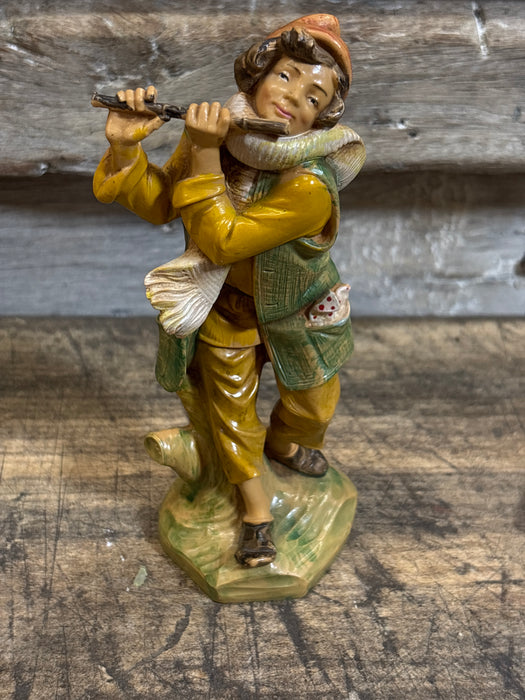 MAN PLAYING FLUTE STATUE