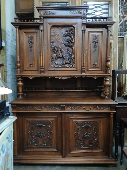 HENRI II  WALNUT BUFFET WITH CARVED HUNTER