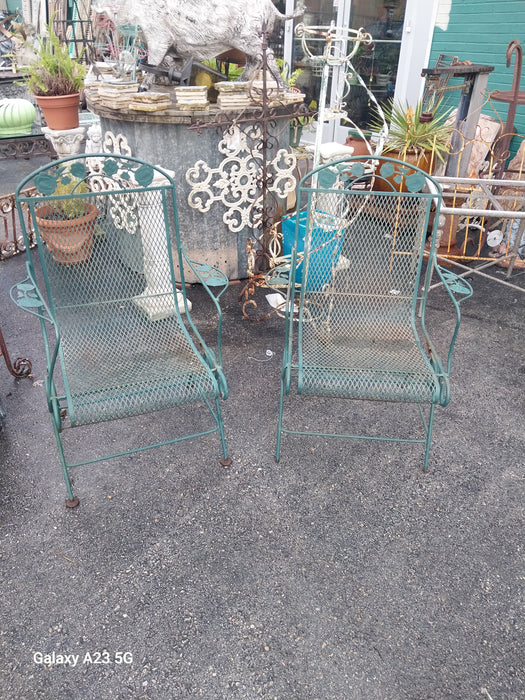 PAIR OF VINTAGE GREEN IRON ROCKING LAWN CHAIRS  WITH AS FOUND LEG