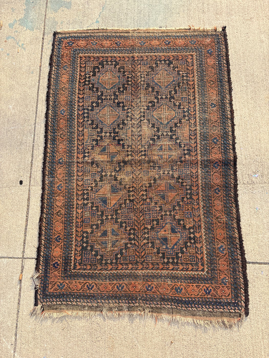 SMALL BLUE, BLACK AND ORANGE HAND TIED RUG