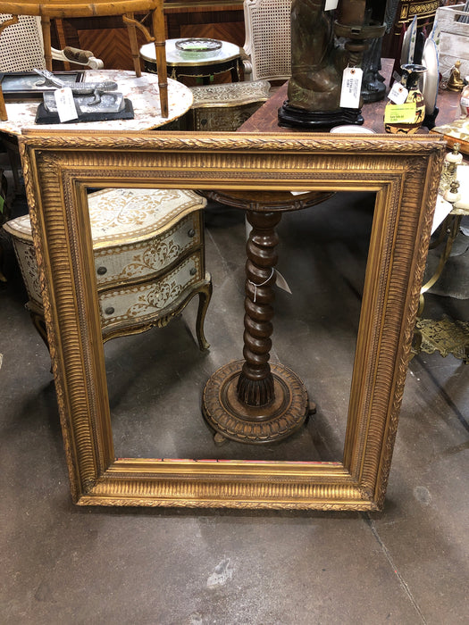 LARGE GILT FRAME WITH LAURELING AND RIBBING