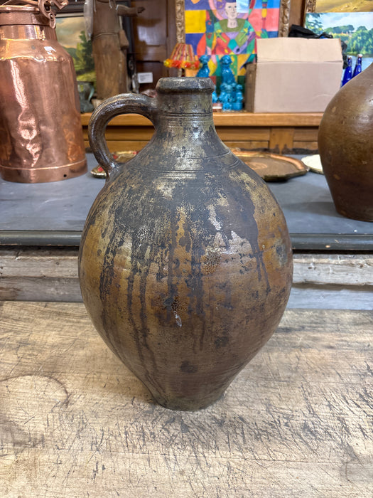 OVOID POTTERY JUG WITH HANDLE