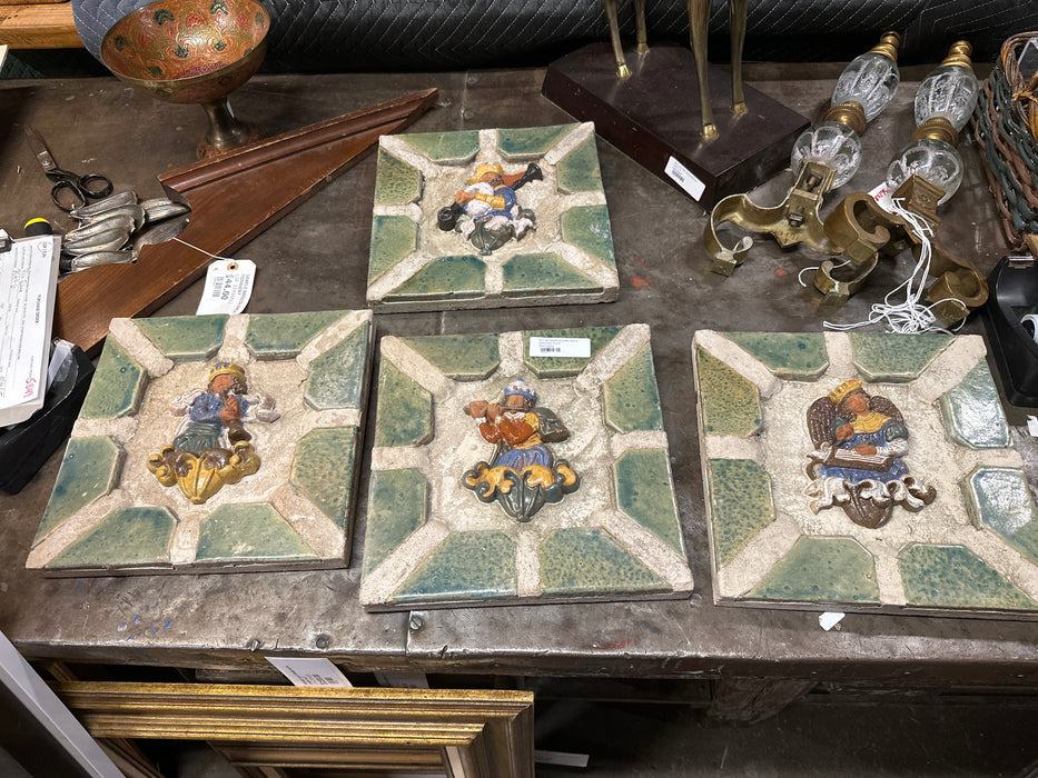 SET OF FOUR FIGURAL WALL HANGING TILES