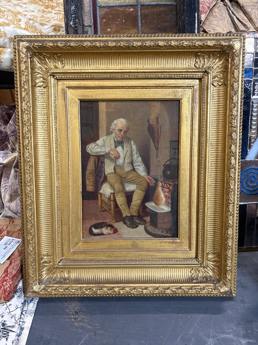 19TH CENTURY GILT FRAMED INTERIOR SCENE OF AVANCULAR MAN WITH CAT - SIGNED C.A