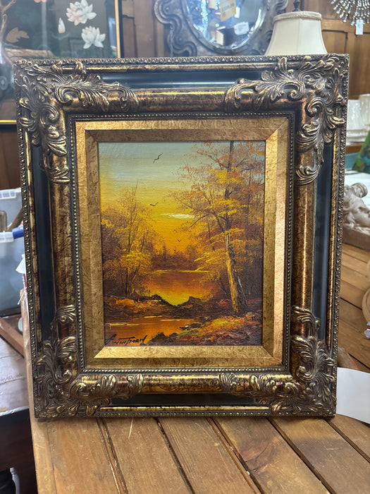 SMALL ORNATE GILT FRAMED VINTAGE SUNDSET LANDSCAPE OIL PAINTING OF A LAKE IN CLEARING - SIGNED