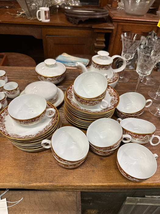 SET OF 12 RED AND GOLD CHINA TEA CUPS WITH POT, BUTTER, SUGAR DISH AND 12 BREAD PLATES