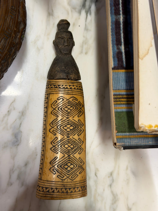 CARVED BONE FIGURINE WITH GEOMETRIC DESIGN