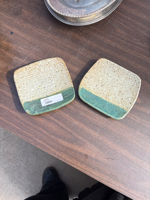 PAIR OF GLAZED GREEN FOOTED PLATES
