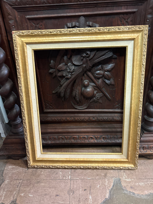 MEDIUM ORNATE GOLD FRAME WITH LINEN FILET 16”W 20”L - AS FOUND