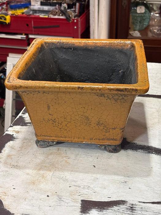 SMALL BLACK AND ORANGE CRACKLED SQUARE POT WITH FEET