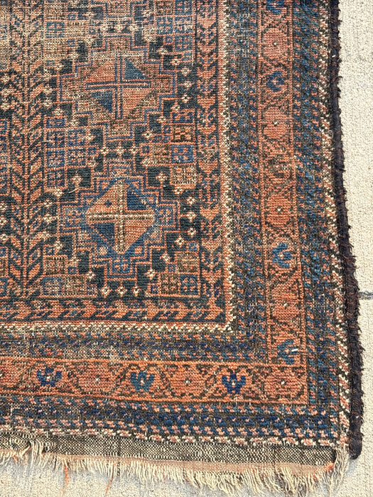 SMALL BLUE, BLACK AND ORANGE HAND TIED RUG