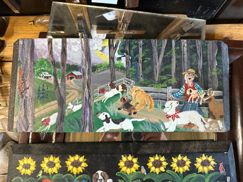 PAINTING ON BOARD  OF GRANDMA WITH DOGS AND GOATS